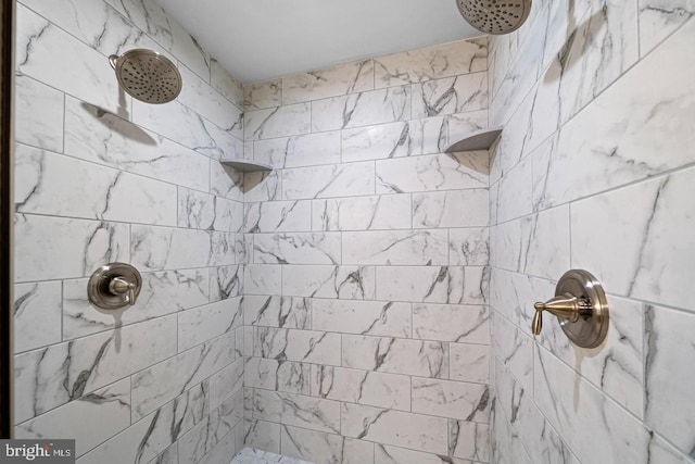 bathroom with a tile shower