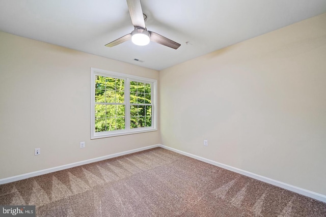 empty room featuring carpet and ceiling fan