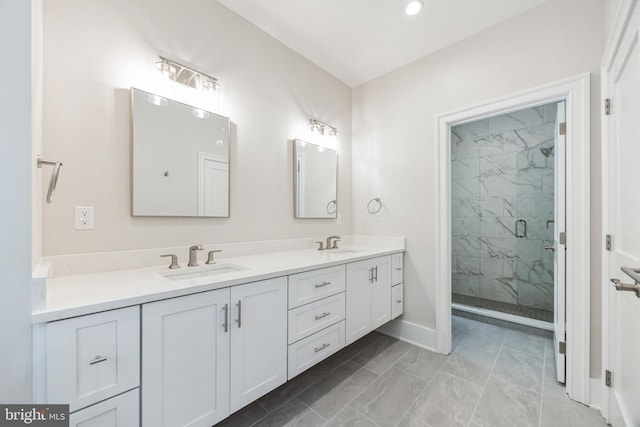 bathroom featuring vanity and an enclosed shower