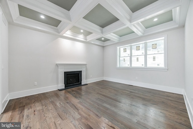 unfurnished living room featuring hardwood / wood-style floors, beamed ceiling, coffered ceiling, and ornamental molding