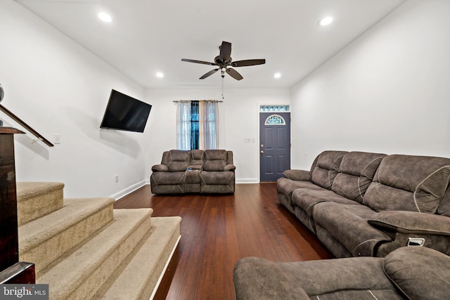 living room with ceiling fan and dark hardwood / wood-style floors