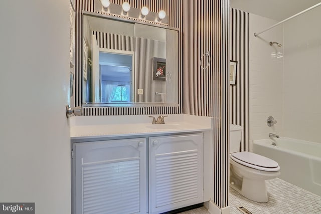 full bathroom featuring toilet, vanity, and tub / shower combination