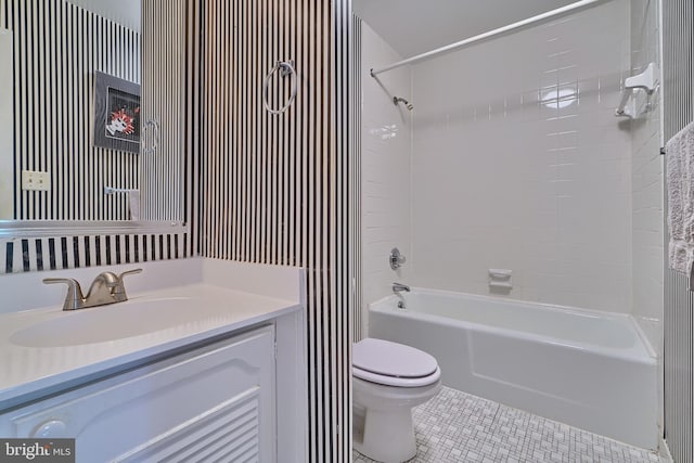 full bathroom with vanity, tile patterned flooring, tiled shower / bath combo, and toilet