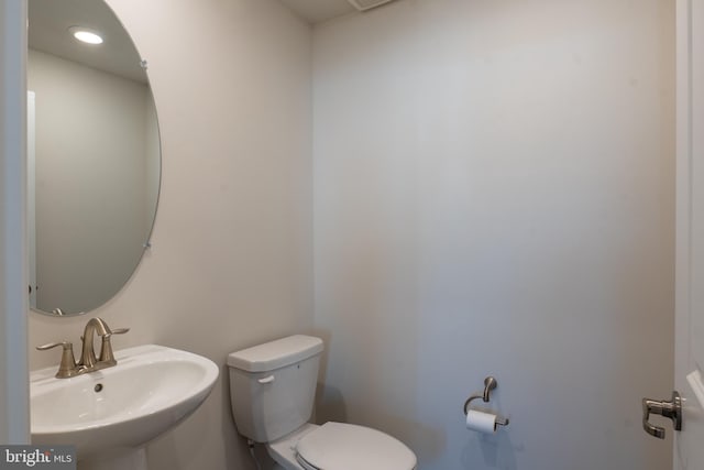 bathroom featuring sink and toilet