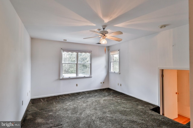 empty room with carpet flooring and ceiling fan