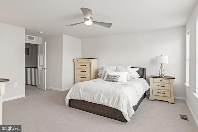 bedroom featuring ceiling fan and light colored carpet