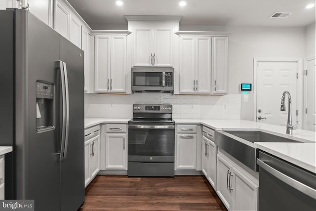 kitchen with white cabinetry and appliances with stainless steel finishes