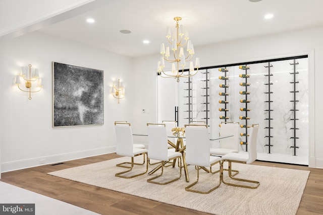 dining room featuring an inviting chandelier and hardwood / wood-style floors