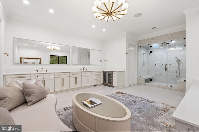 bathroom with vanity, a notable chandelier, beverage cooler, and ornamental molding