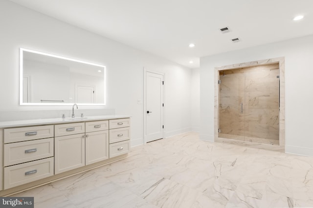 bathroom with walk in shower and vanity