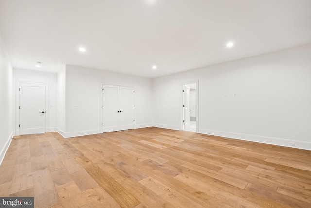 spare room with light wood-type flooring