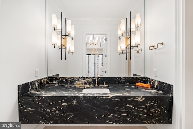 bathroom featuring vanity and ornamental molding