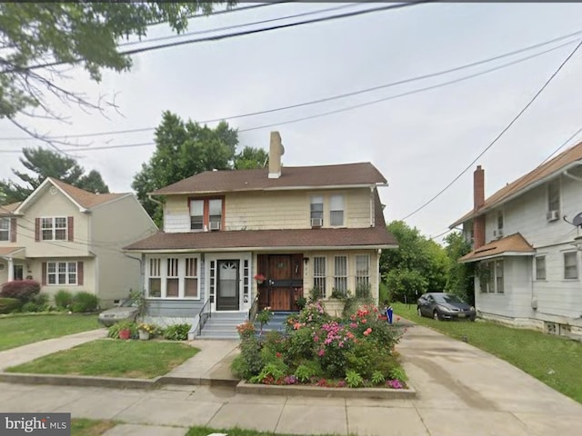 view of front of home with a front yard