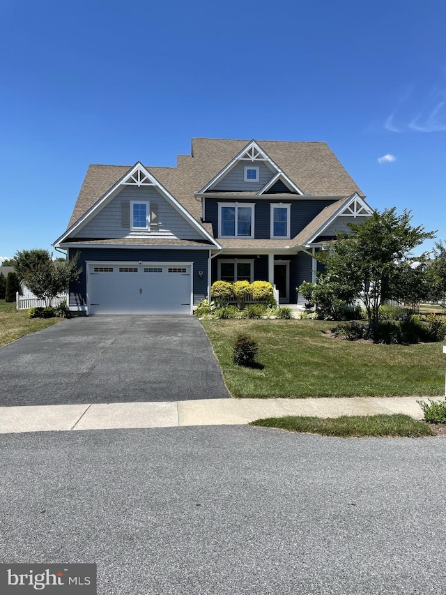 craftsman-style home featuring a front lawn