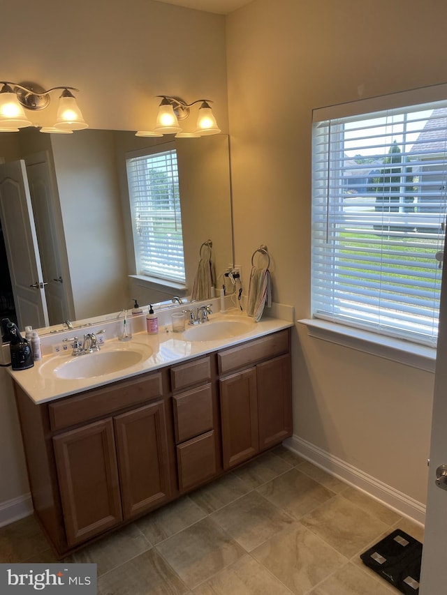 bathroom featuring tile patterned floors, vanity, and a wealth of natural light