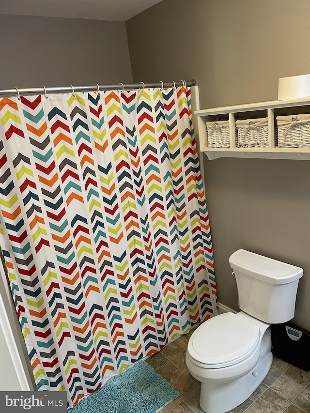 bathroom featuring tile patterned floors and toilet