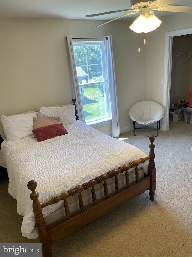 bedroom with carpet flooring, ceiling fan, and a closet