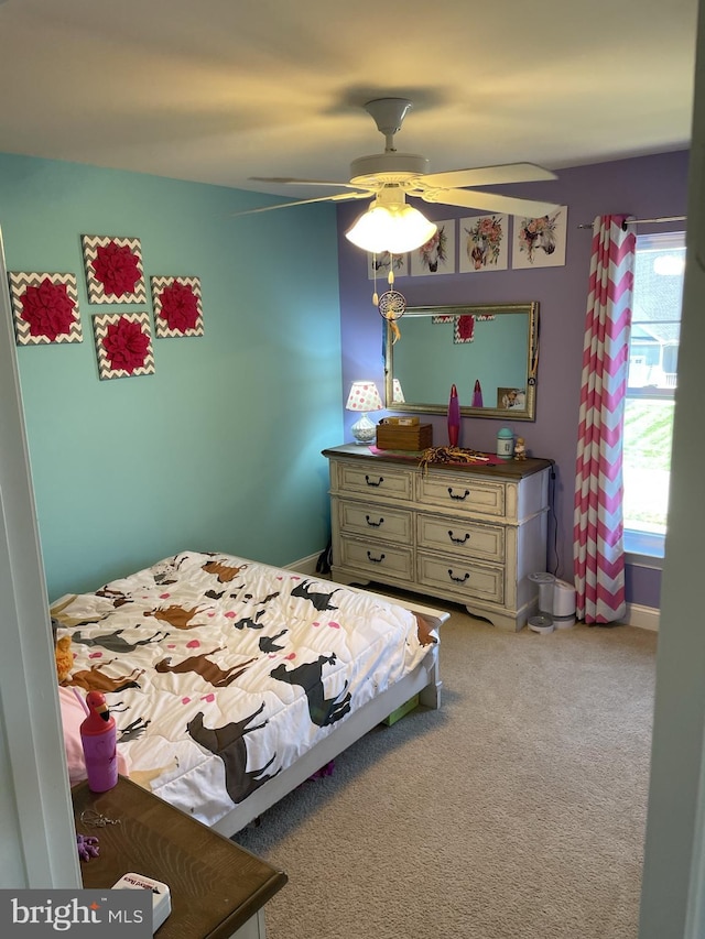 bedroom featuring ceiling fan and light colored carpet