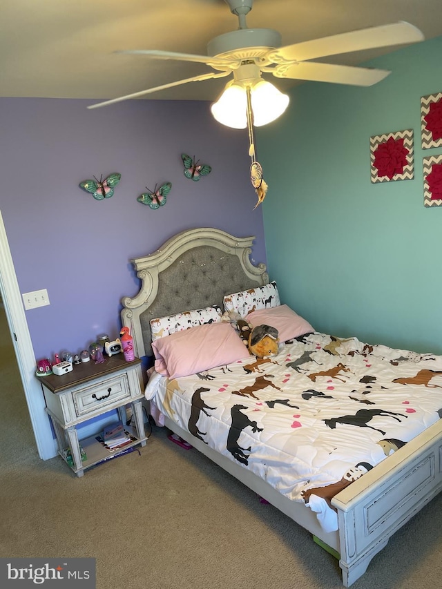 unfurnished bedroom featuring carpet floors and ceiling fan