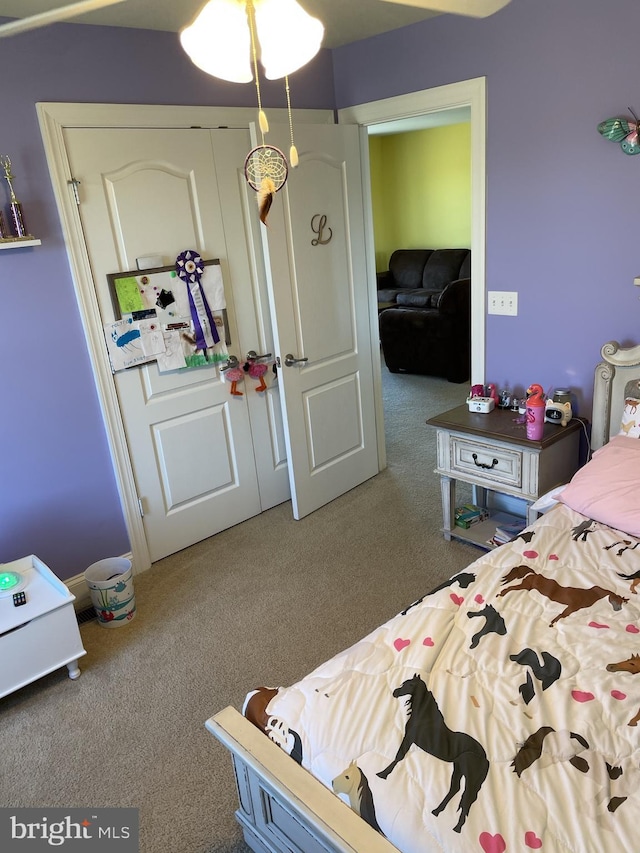 carpeted bedroom featuring a closet