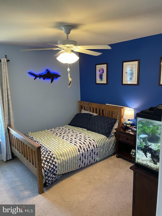 carpeted bedroom with ceiling fan