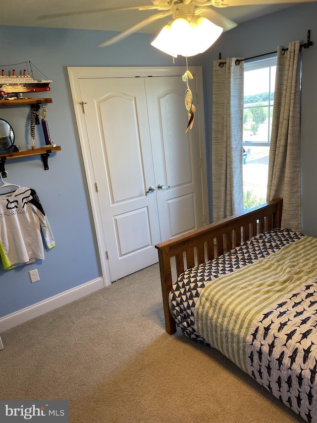 bedroom featuring carpet flooring, a closet, and ceiling fan