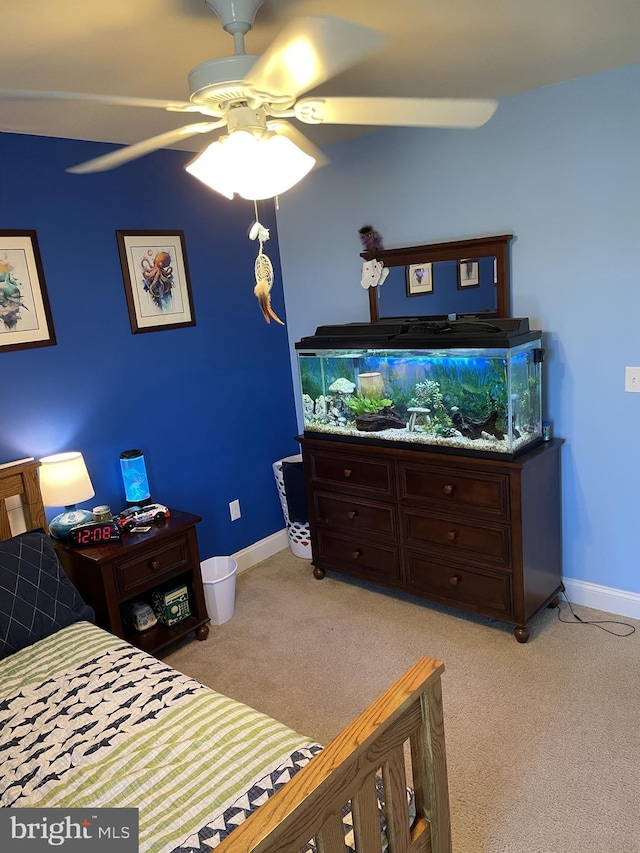 bedroom with ceiling fan and light colored carpet