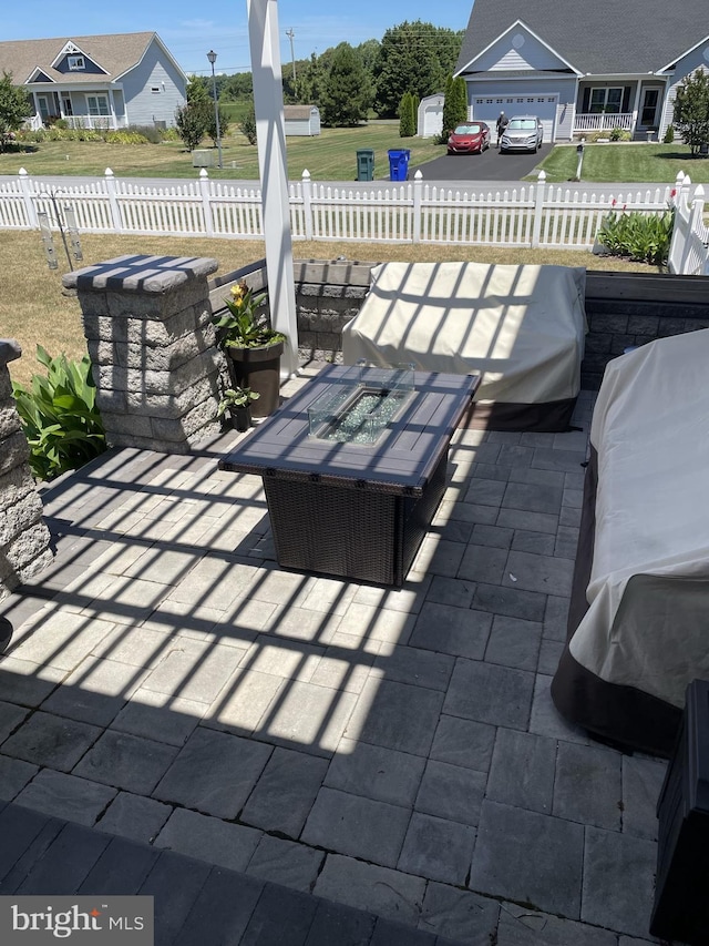 view of patio featuring a fire pit