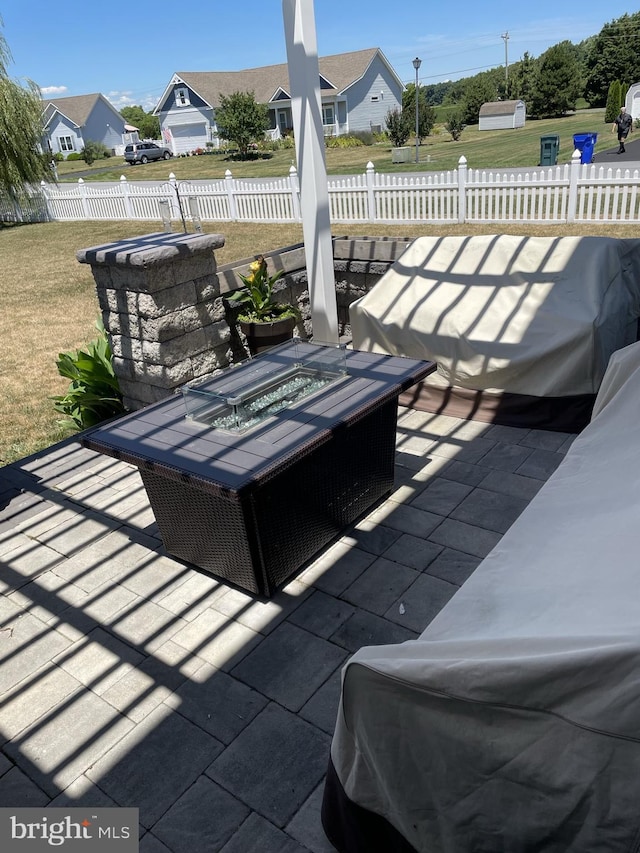 view of patio / terrace featuring an outdoor fire pit