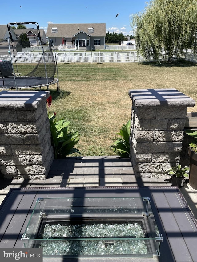 view of yard with a trampoline