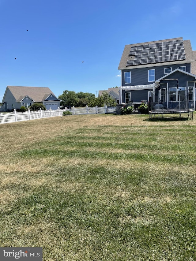 view of yard with a trampoline