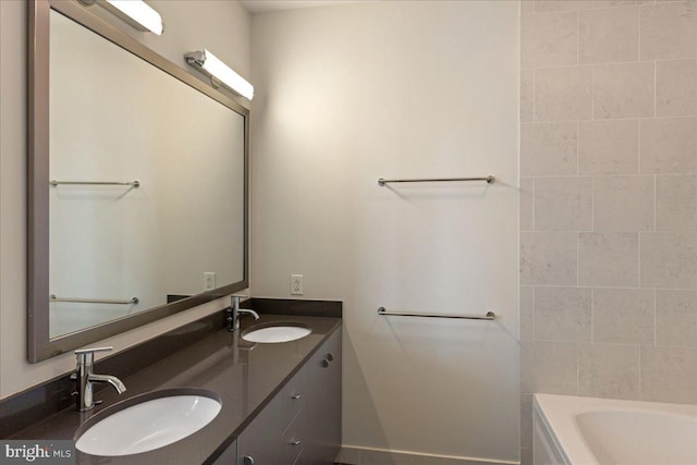 bathroom featuring vanity and a bathtub