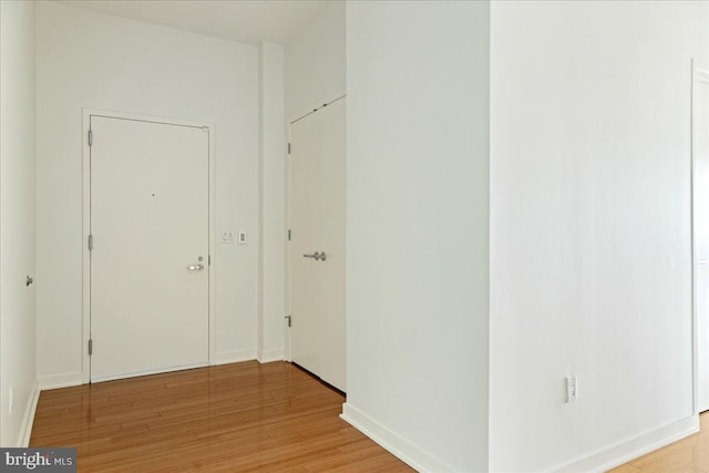 corridor featuring light hardwood / wood-style floors