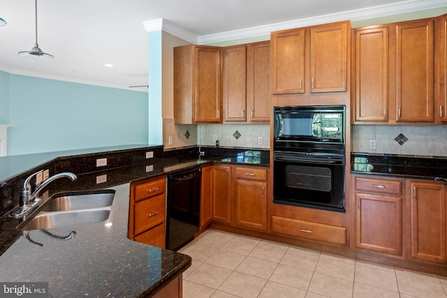 kitchen with dark stone countertops, tasteful backsplash, light tile patterned floors, black appliances, and sink