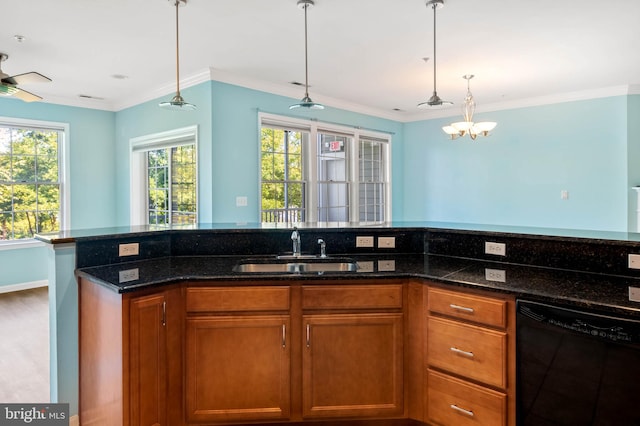 kitchen featuring sink, hanging light fixtures, dark stone countertops, dishwasher, and hardwood / wood-style flooring