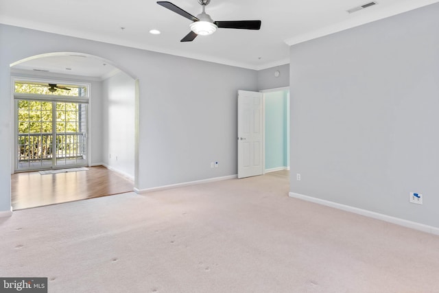 interior space featuring carpet flooring, crown molding, and ceiling fan