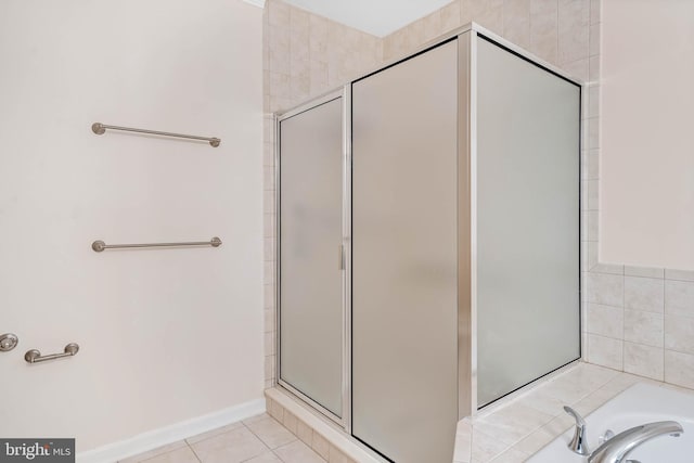 bathroom featuring tile patterned floors and walk in shower