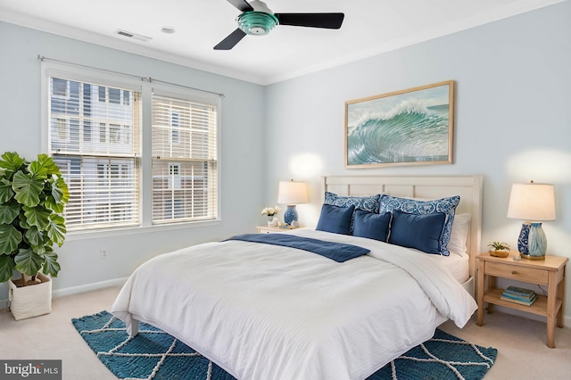 carpeted bedroom with crown molding and ceiling fan