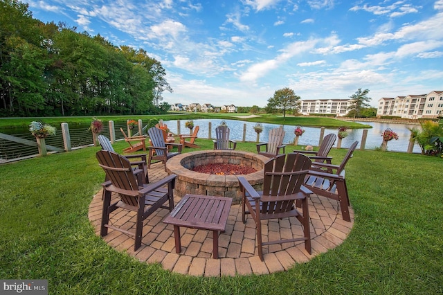 view of patio / terrace with a water view and an outdoor fire pit