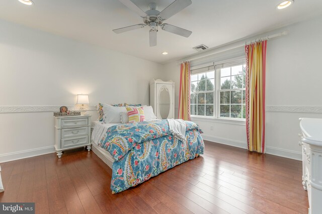 bedroom with ceiling fan and wood-type flooring