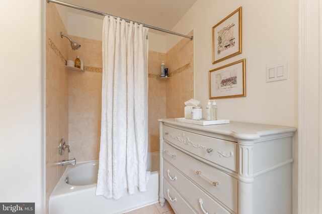 bathroom with tile patterned floors and shower / bathtub combination with curtain