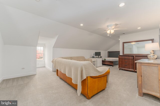 bedroom featuring ceiling fan, light carpet, and vaulted ceiling