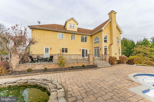 rear view of property with a patio area