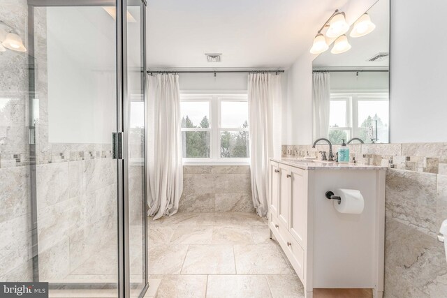 bathroom featuring vanity and a wealth of natural light