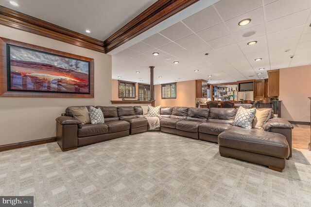 carpeted living room featuring ornamental molding