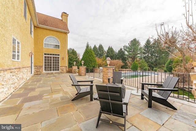 view of patio featuring a pool