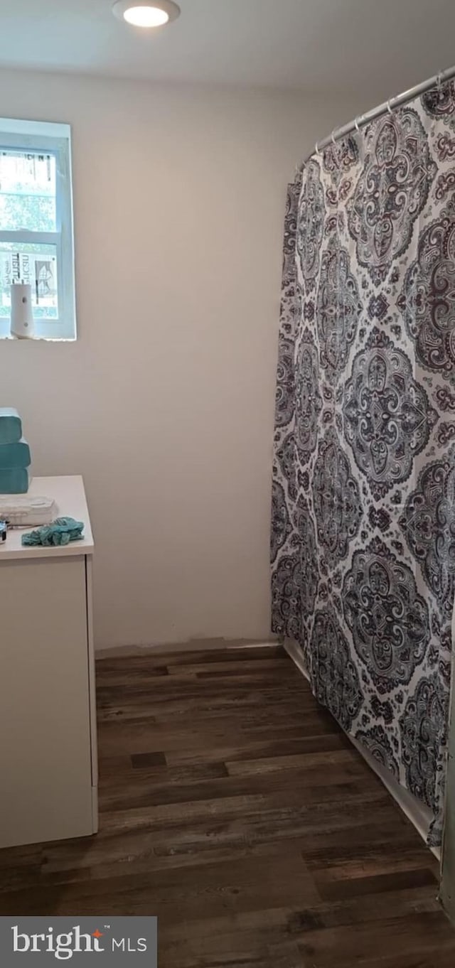 bathroom featuring vanity and hardwood / wood-style flooring