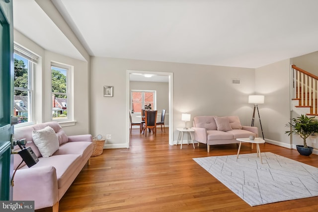 living room with light hardwood / wood-style flooring