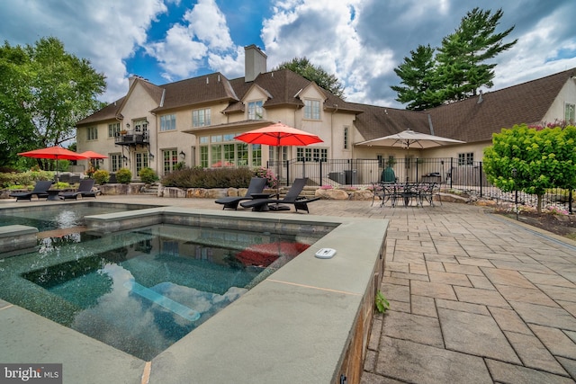 view of pool featuring a patio area