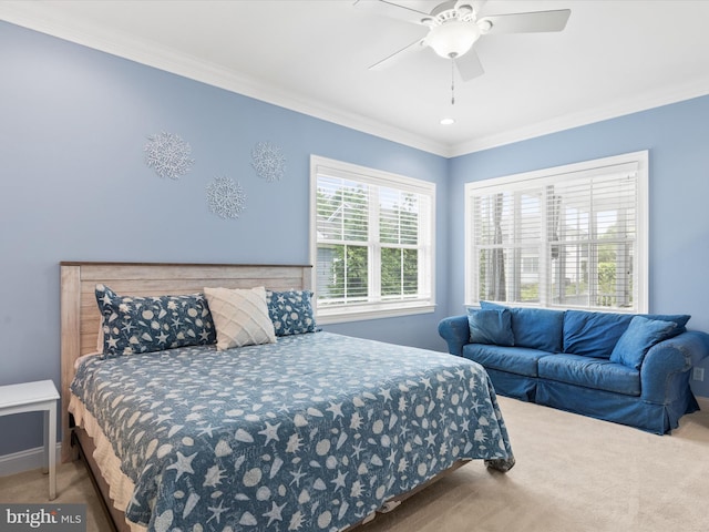 bedroom featuring carpet flooring, ceiling fan, and crown molding